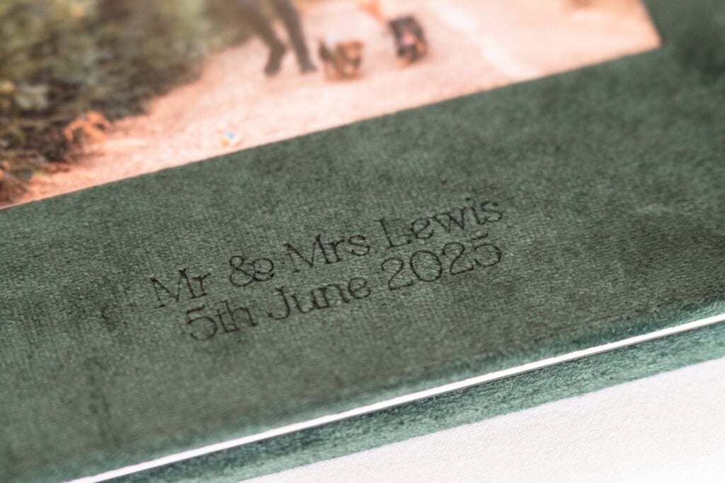 Green wedding album with Mr and Mrs Lewis text.